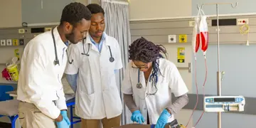Medical Student Learning to Give an Injection on a Dummy Arm - SA